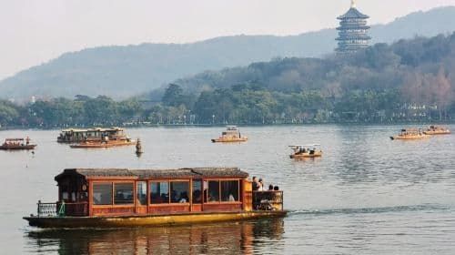 Leifeng Tower admission ticket + West Lake painted cruise (landing on Three Pools Mirroring the Moon island) ticket + live guide service Day Tours