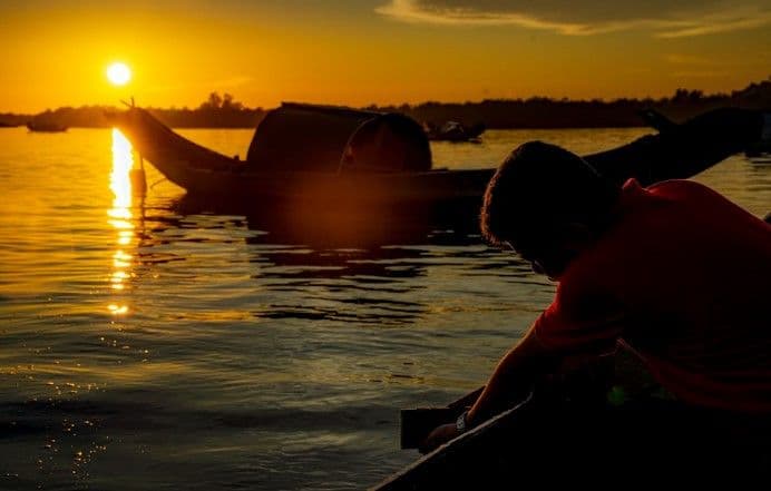 Sunrise Over Floating Market on Tam Giang Lagoon