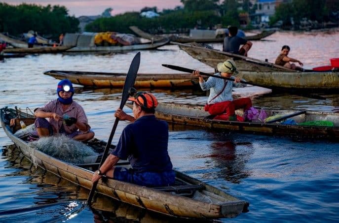 Sunrise Over Floating Market on Tam Giang Lagoon